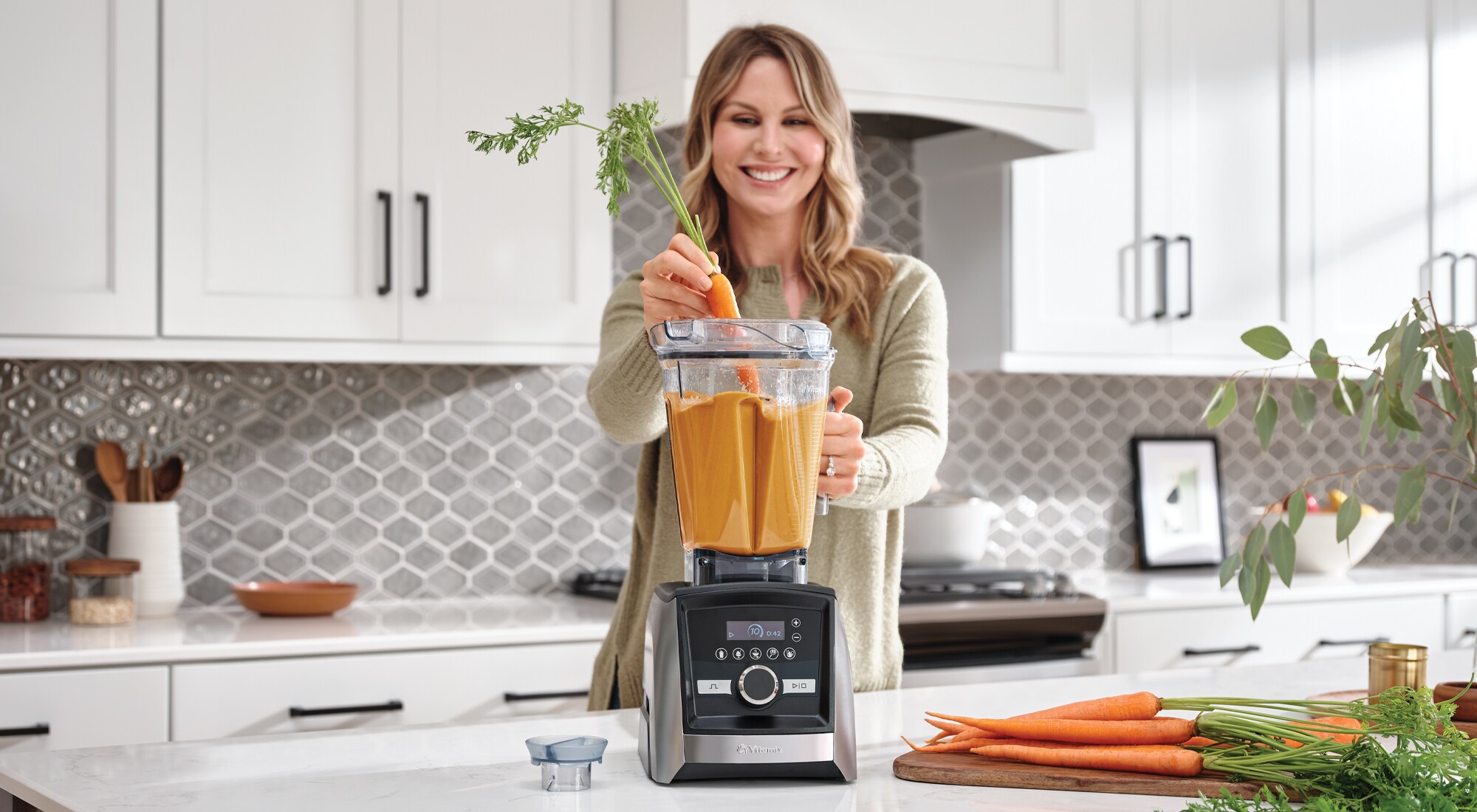 woman blending carrotts
