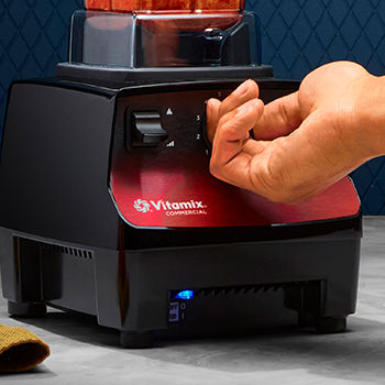 Person turning dial on Vita-Prep Blender