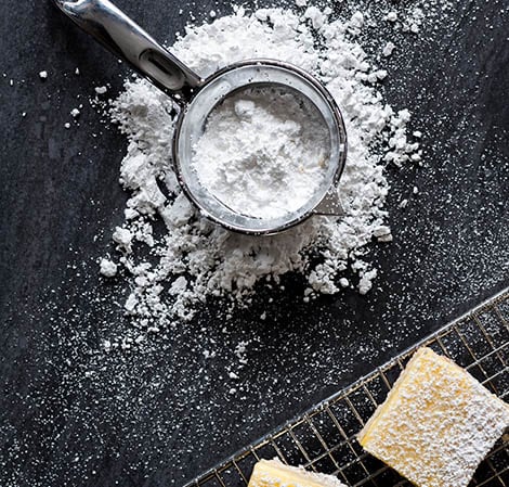 powdered sugar on lemon squares