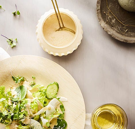 Sesame Dressing sesame dressing in a jar with a salad