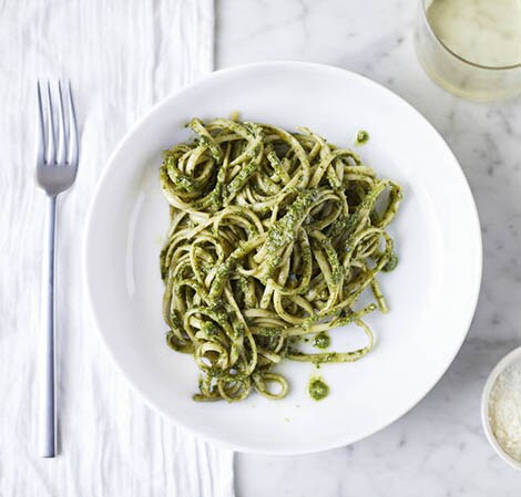 Basil Walnut Pesto spaghetti with basil walnust pesto on a white plate